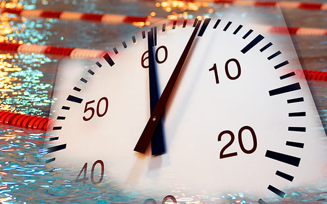 Stoppuhr mit einem Schwimmbecken im Hintergrund steht symbolisch für die Öffnungszeiten des Taubertsbergbads Stoppuhr mit einem Schwimmbecken im Hintergrund steht symbolisch für die Öffnungszeiten des Taubertsbergbads